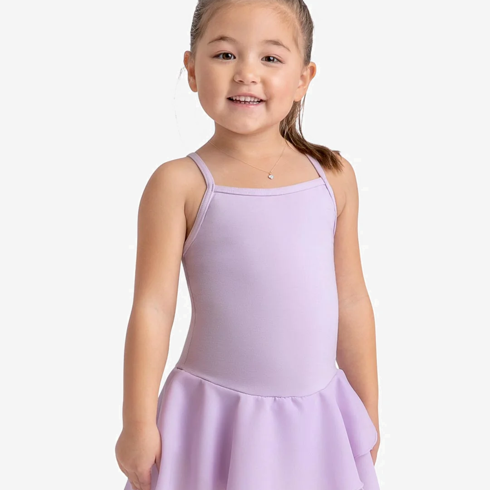 Young smiling girl wears a lavender leotard with attached skirt