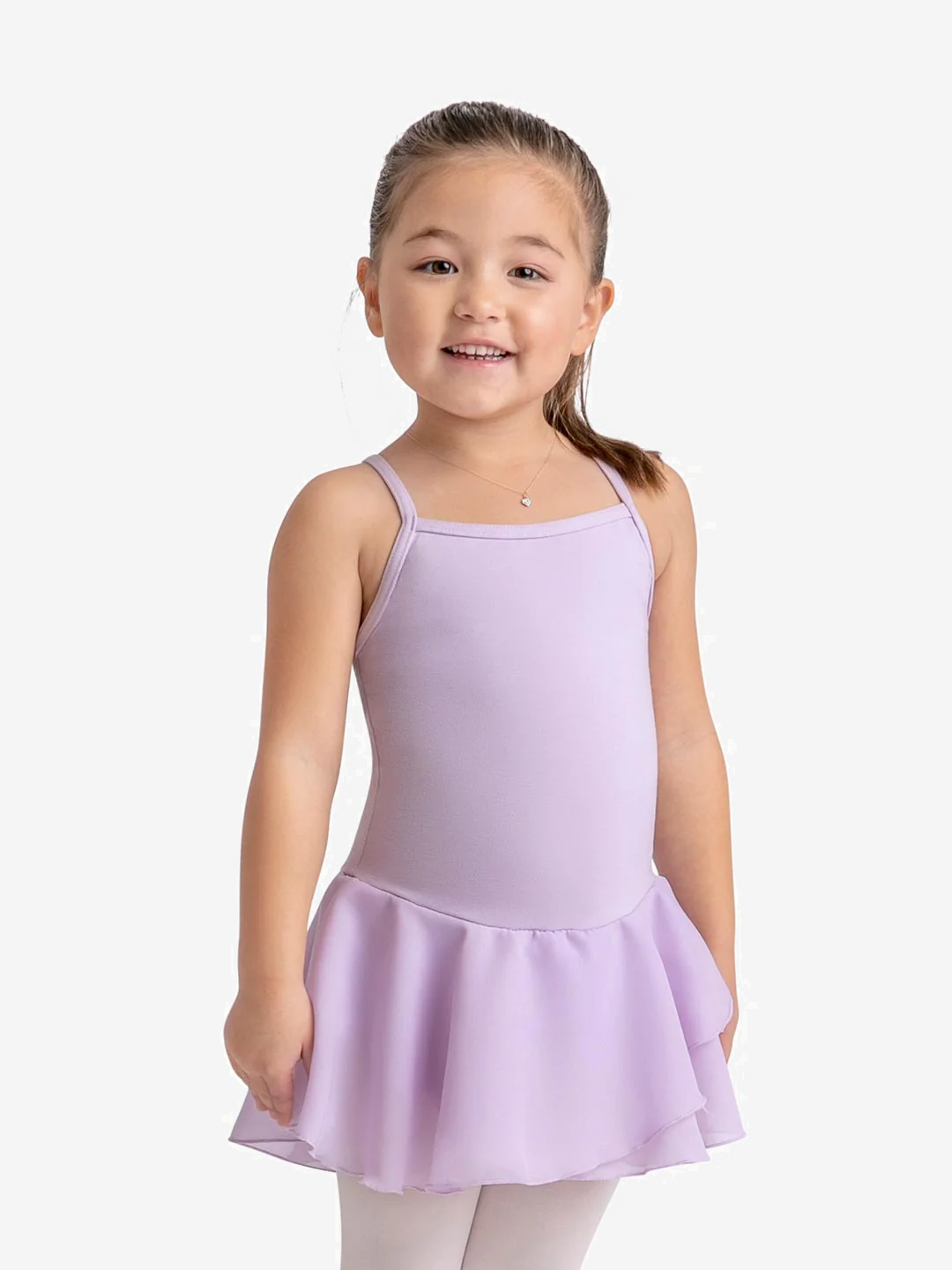 Young smiling girl wears a lavender leotard with attached skirt