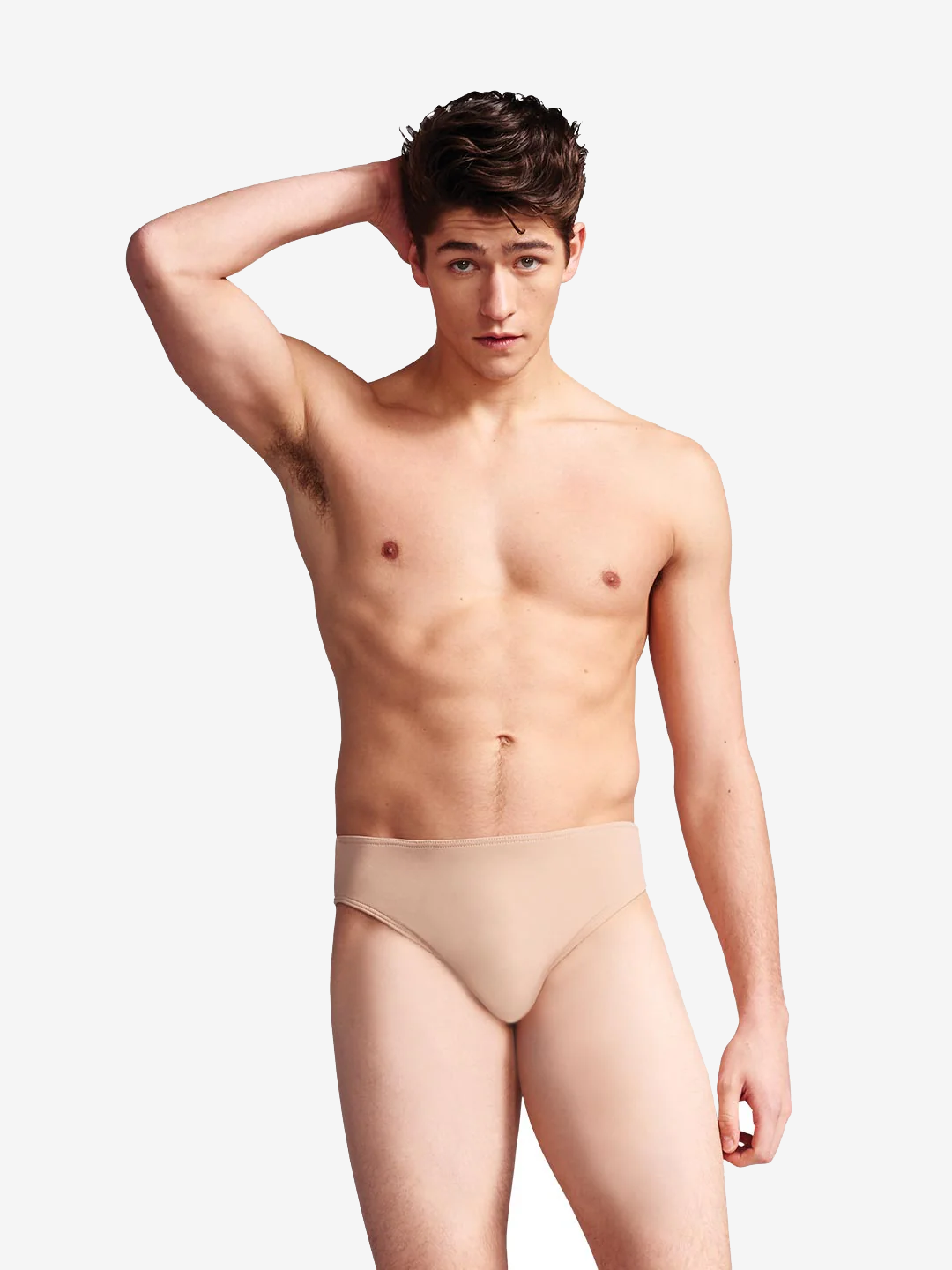 A young man with short brown hair is standing against a plain background with one hand behind his head. He is shirtless and wearing a beige-colored compression garment. He has a neutral expression and is looking directly at the camera.