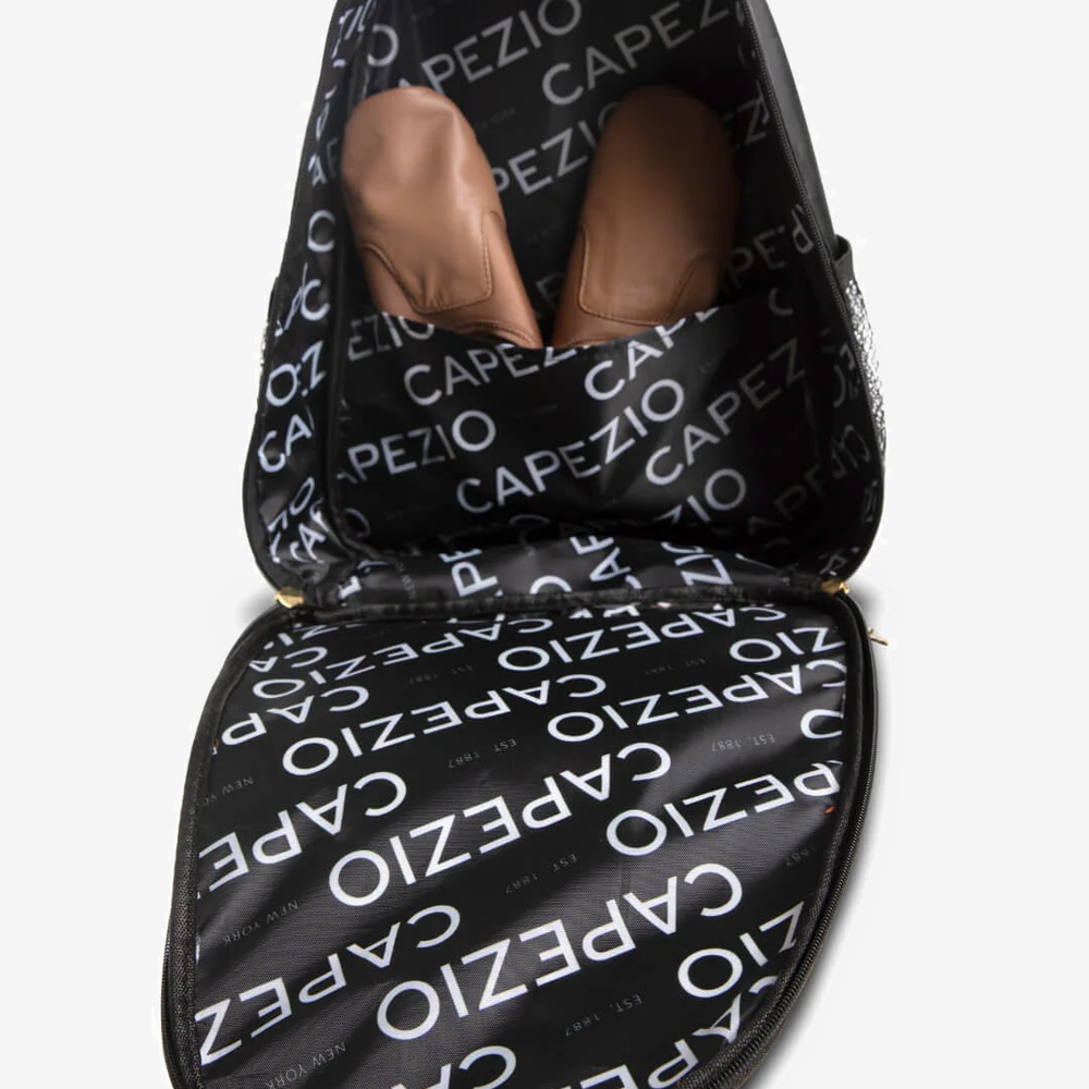 
                      
                        Open black backpack  'CAPEZIO' branding inside 
                      
                    