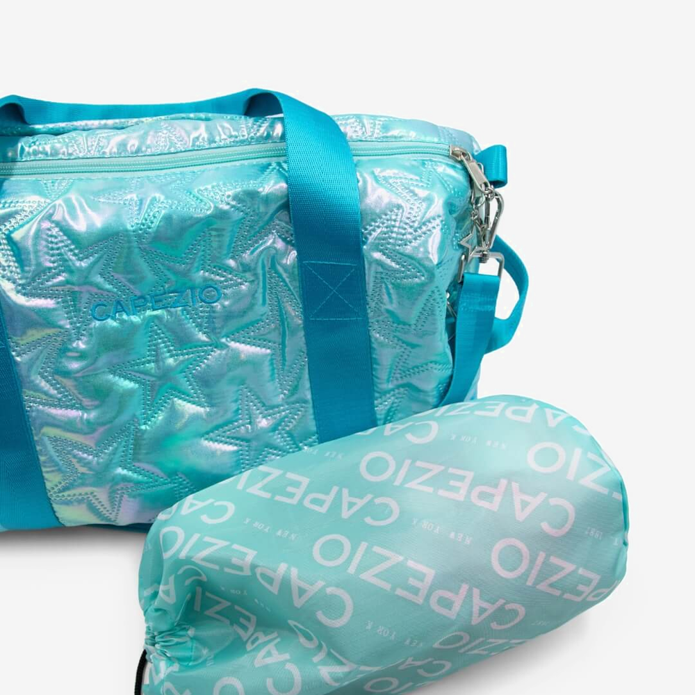 
                      
                        Turquoise duffel bag with matching drawstring bag on a white background
                      
                    