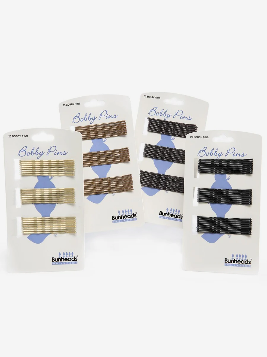 Four vertical packages of four different colored bobby pin sets from blonde, light brown, dark brown, to black, against a light grey background. Bunheads logo is visible on the package.