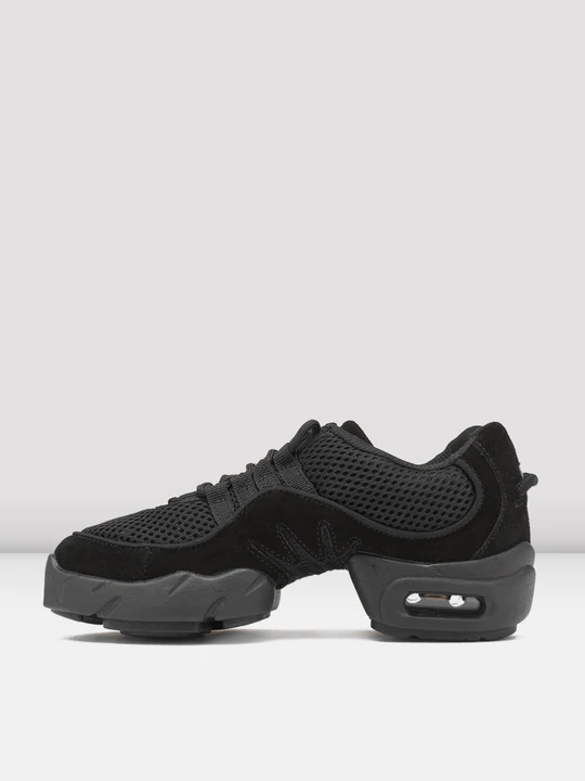 
                      
                        Side view (toe pointed left) of a pair of black sneakers with mesh and suede textures. The shoes feature a thick, cushioned split-sole. Light grey, plain background.
                      
                    