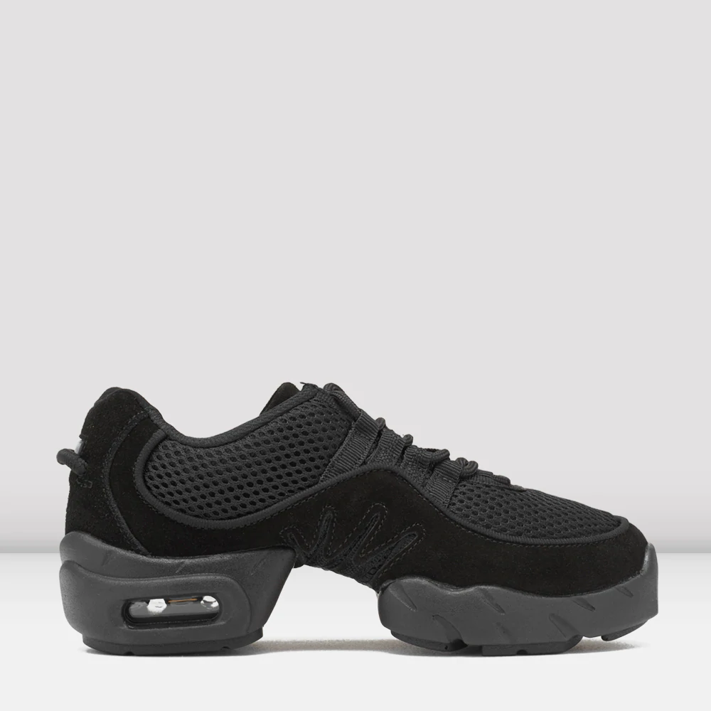 Side view of a pair of black sneakers with mesh and suede textures. The shoes feature a thick, cushioned split-sole. Light grey, plain background.