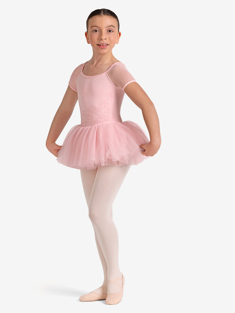 
                      
                        Young girl in a pink ballet outfit on a white background
                      
                    