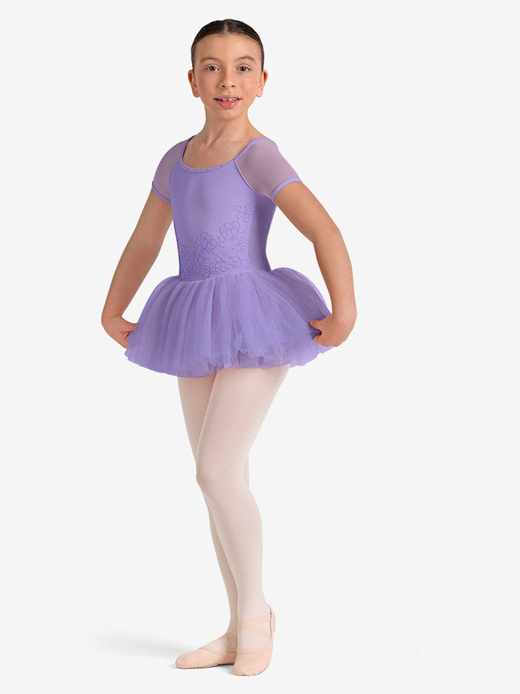 
                      
                        Young girl in a purple ballet outfit on a white background
                      
                    