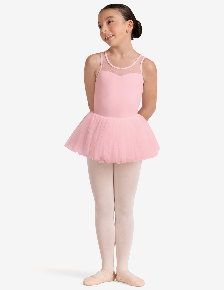 Young girl in a pink ballet dress on a white background