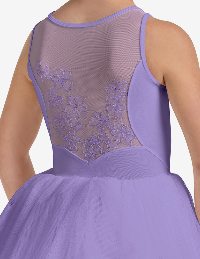 
                      
                        Lilac dress with floral embroidery on a plain background
                      
                    