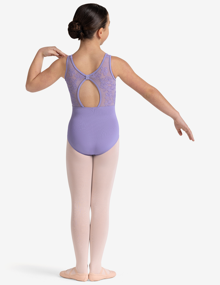
                      
                        Ballerina in a lilac leotard with open back on a white background
                      
                    