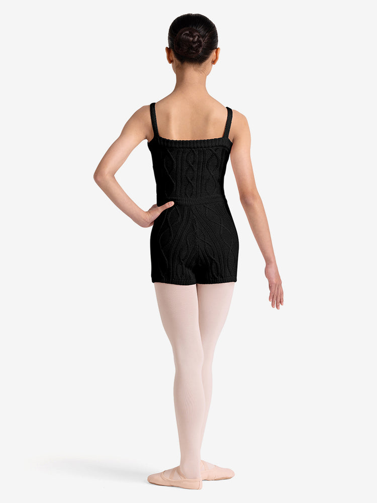 
                      
                        Ballerina in a black knit unitard on a white background
                      
                    