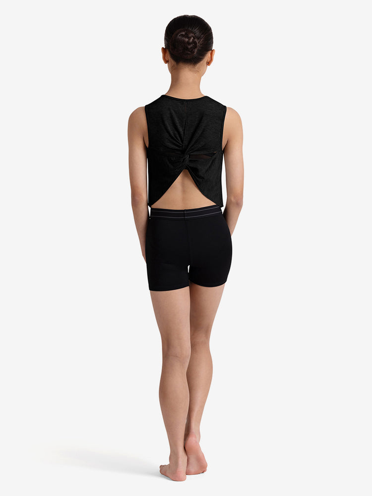
                      
                        Girl wearing a black sleeveless top and shorts on a white background
                      
                    