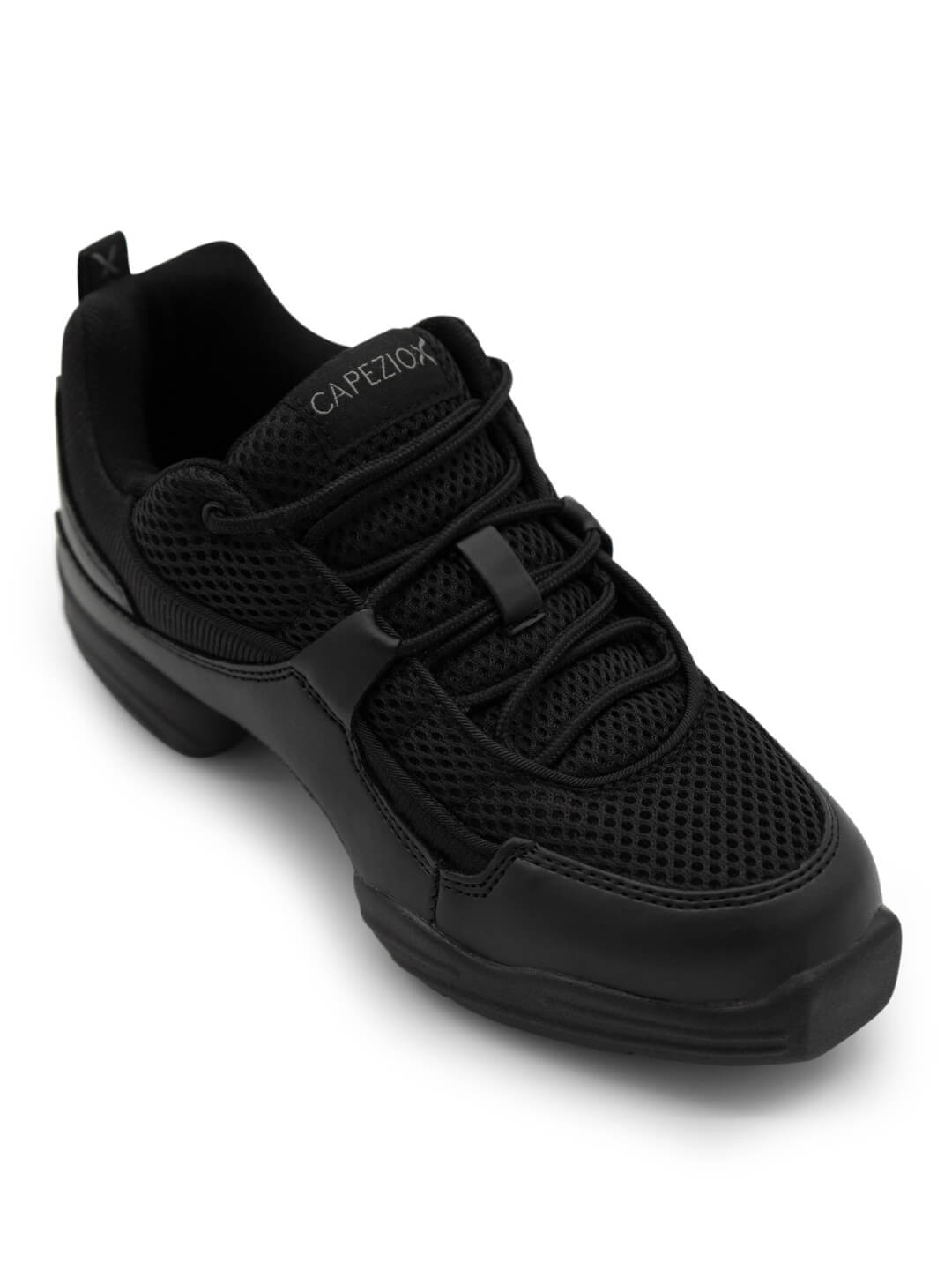 Close-Up of a black sneaker with mesh upper and a split-sole. Capezio logo on the tongue.
