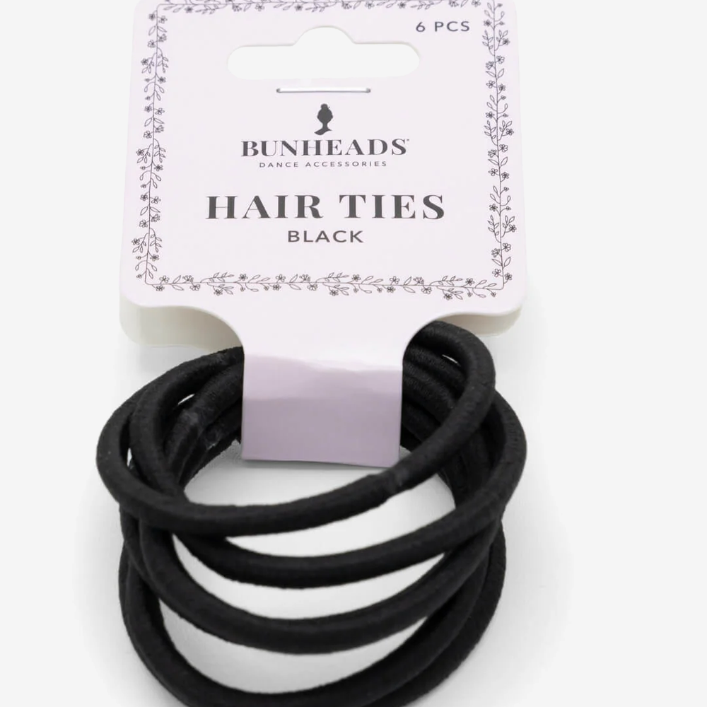 
                      
                        A single package of six black hair ties against a plain background.
                      
                    