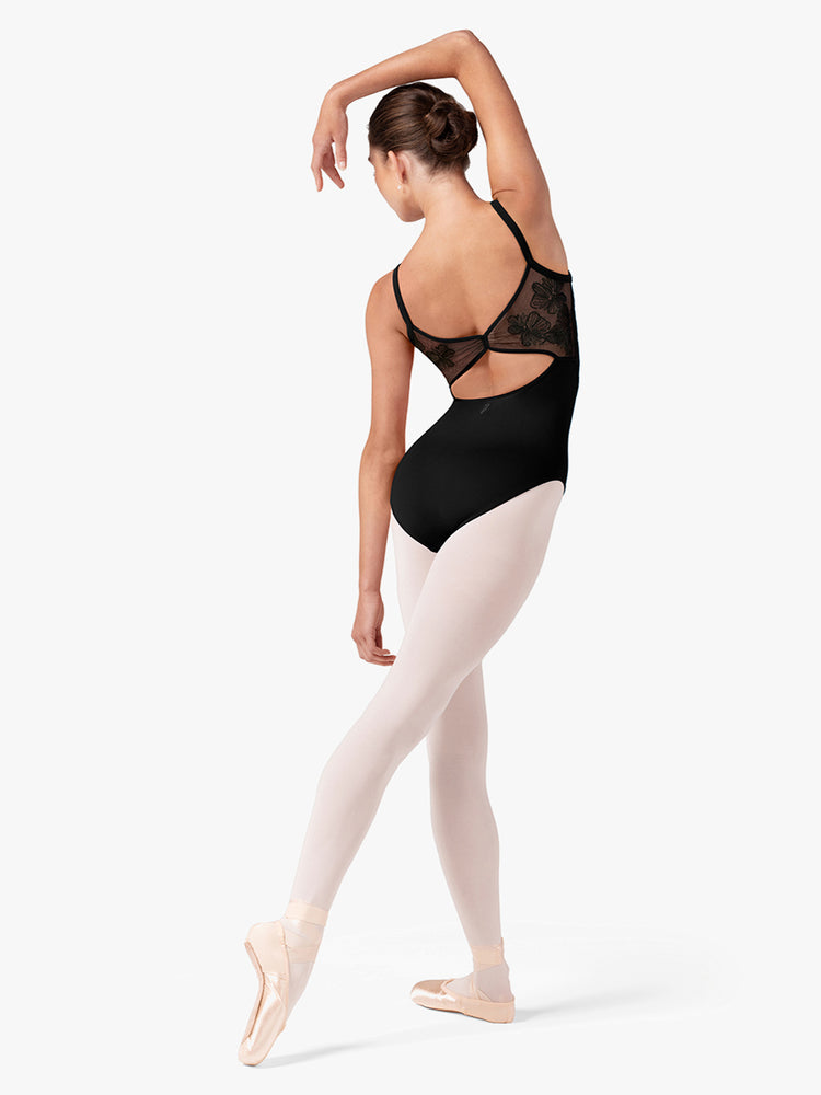 
                      
                        Ballerina in a black leotard and pink tights on a white background
                      
                    