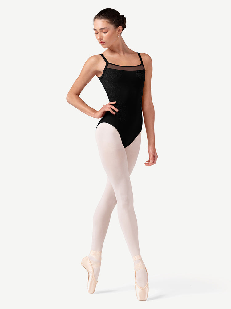 Dancer in a black leotard and pink tights on a white background