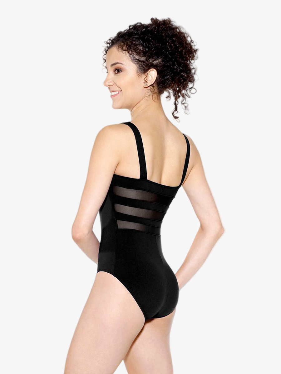 Woman wearing a black leotard with mesh panels on a white background