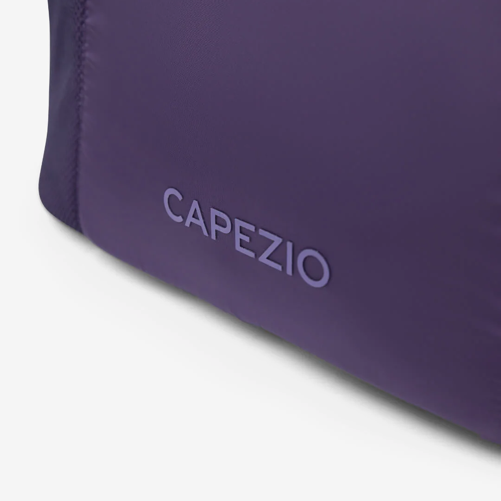 
                      
                        Purple bag with 'Capezio' branding on a white background
                      
                    