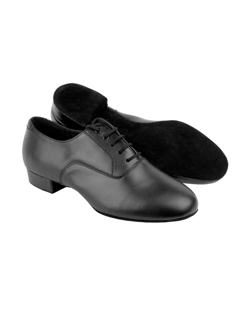 A pair of black leather, lace-up, round toe, men's ballroom shoe, with a standard heel. The back shoe is laid on it's side to showcase the suede bottom.