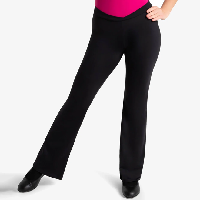 Person wearing black jazz pants and a pink top on a white background