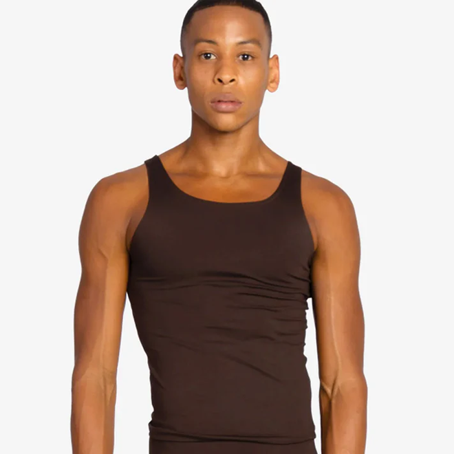 Man wearing a brown tank top against a white background