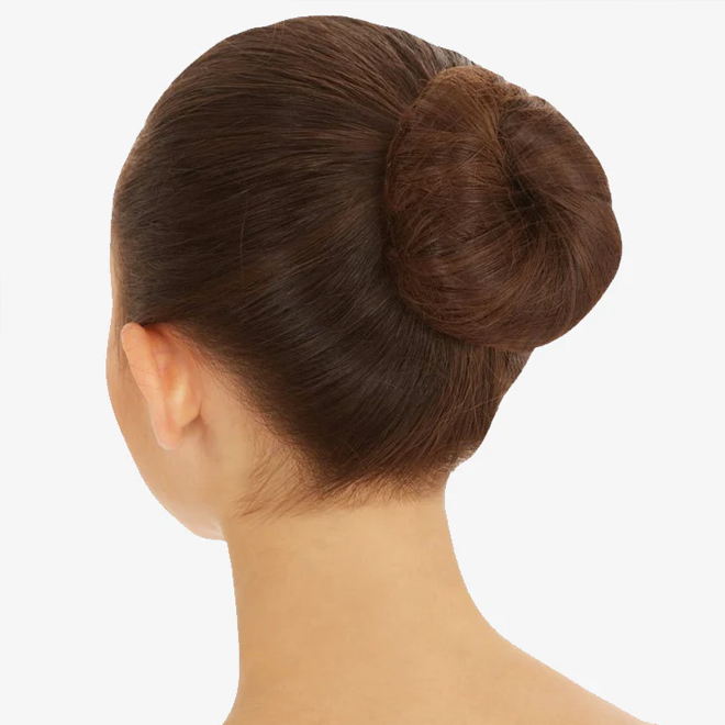 Girl with brown hair in a bun on a white background