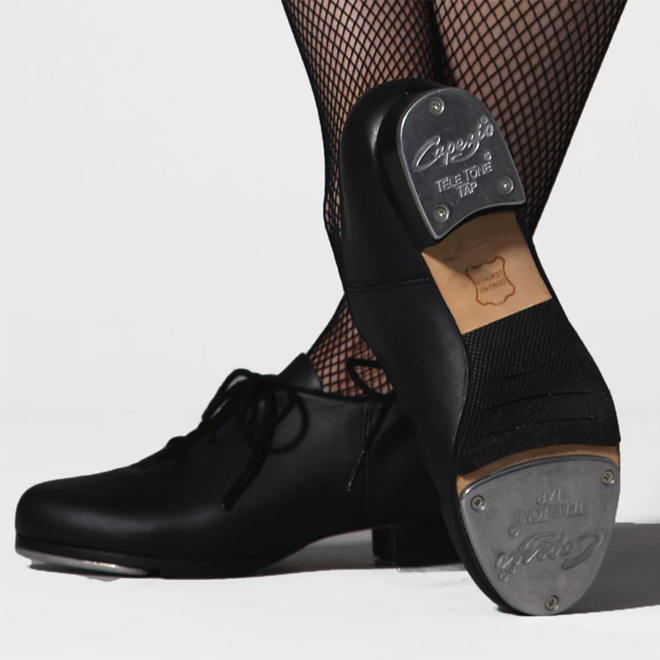 Black tap dance shoe with visible brand logo on the tap on a white background