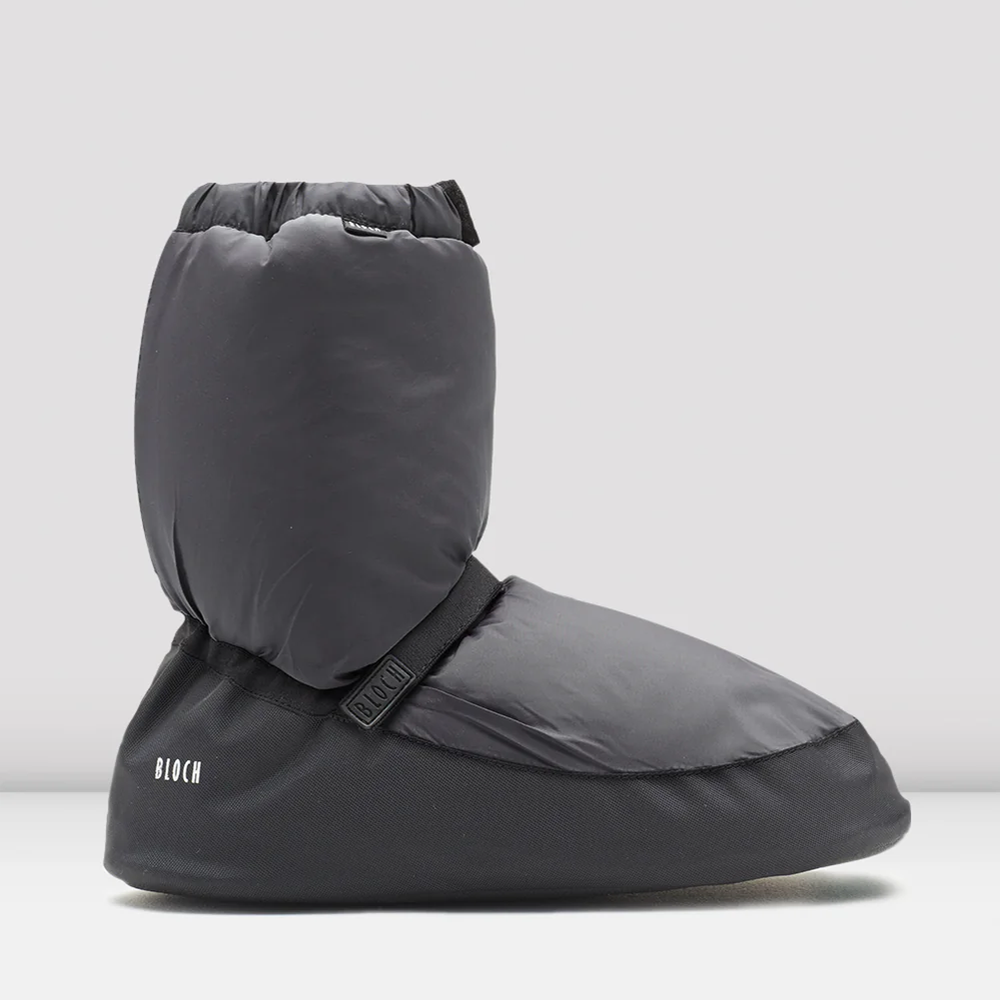 Gray slip-on booties with a brand logo on a grey background