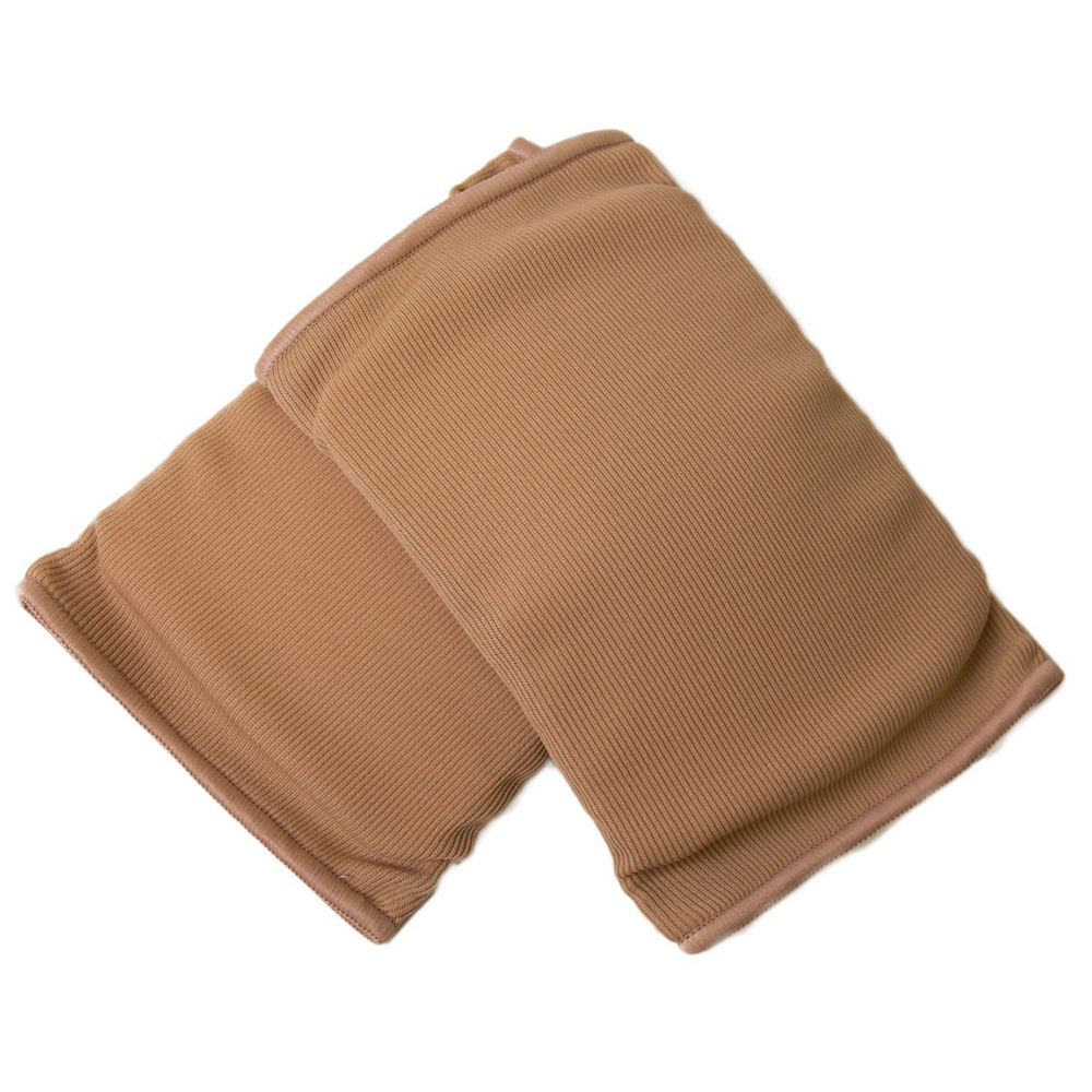 A pair of nude colored, stretchy material kneepads against a white background.