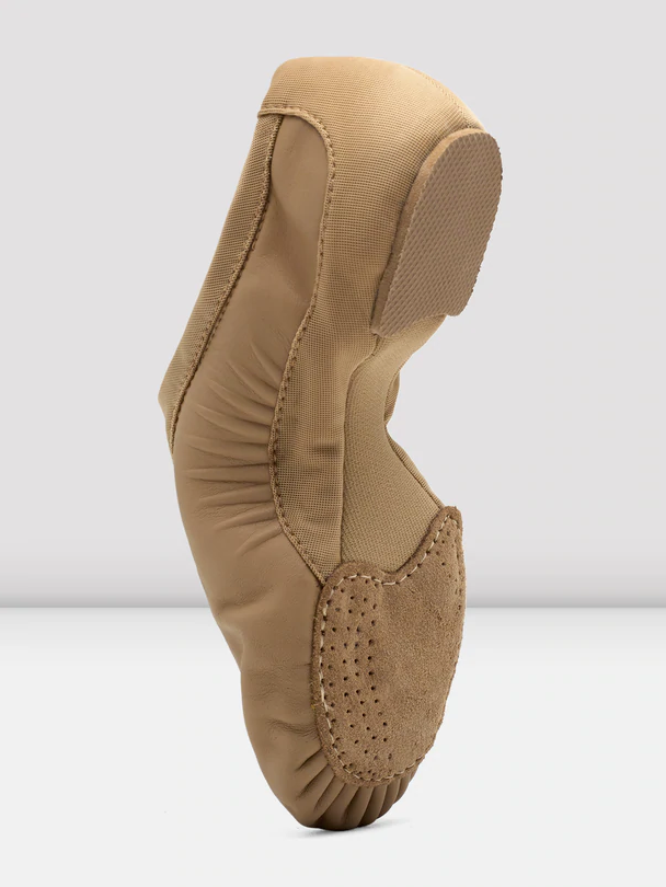 
                      
                        Angled side and bottom view of a tan jazz shoe showing its suede front sole and low profile dance rubber heel
                      
                    