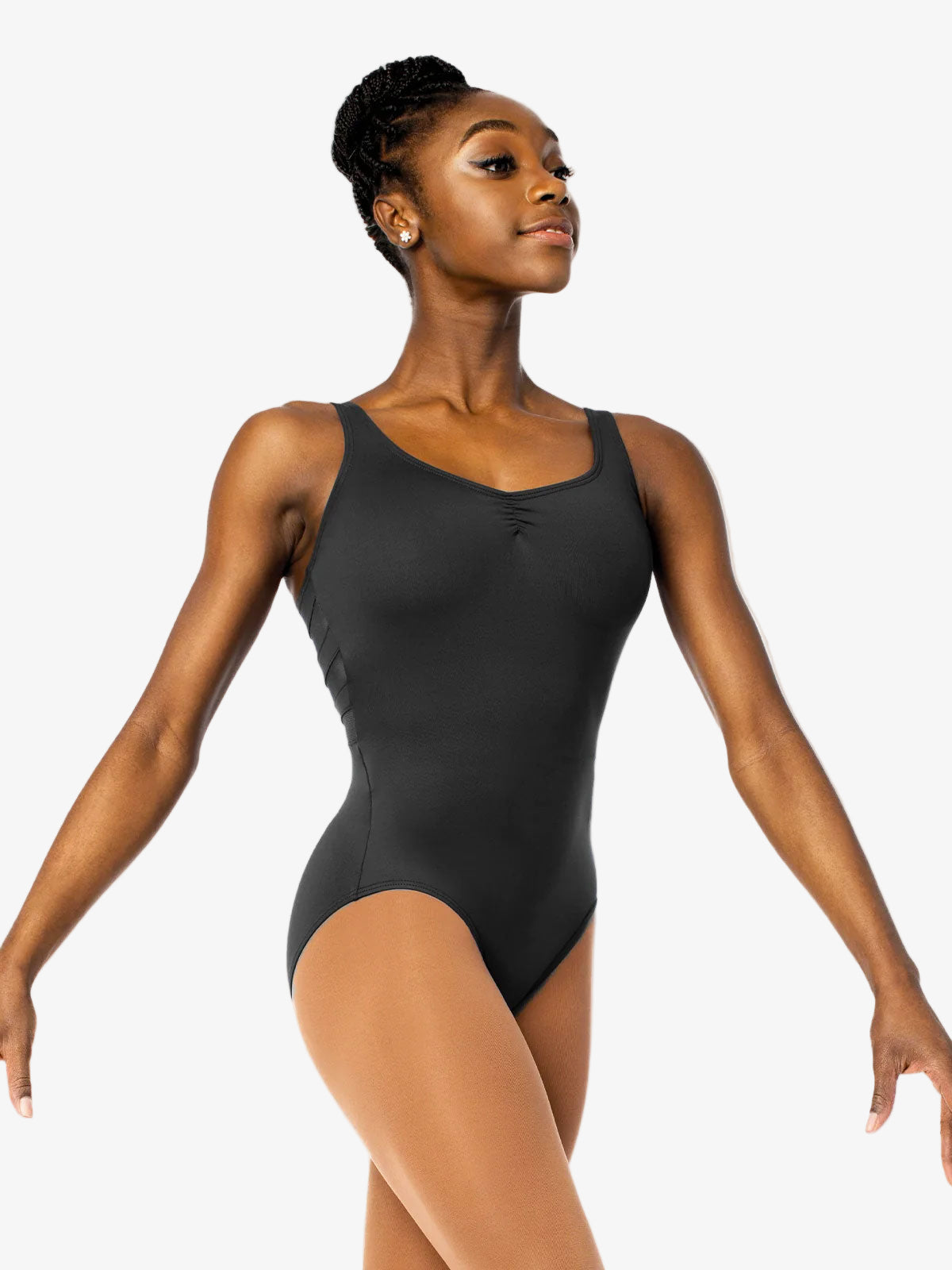 Woman wearing a black leotard on a white background