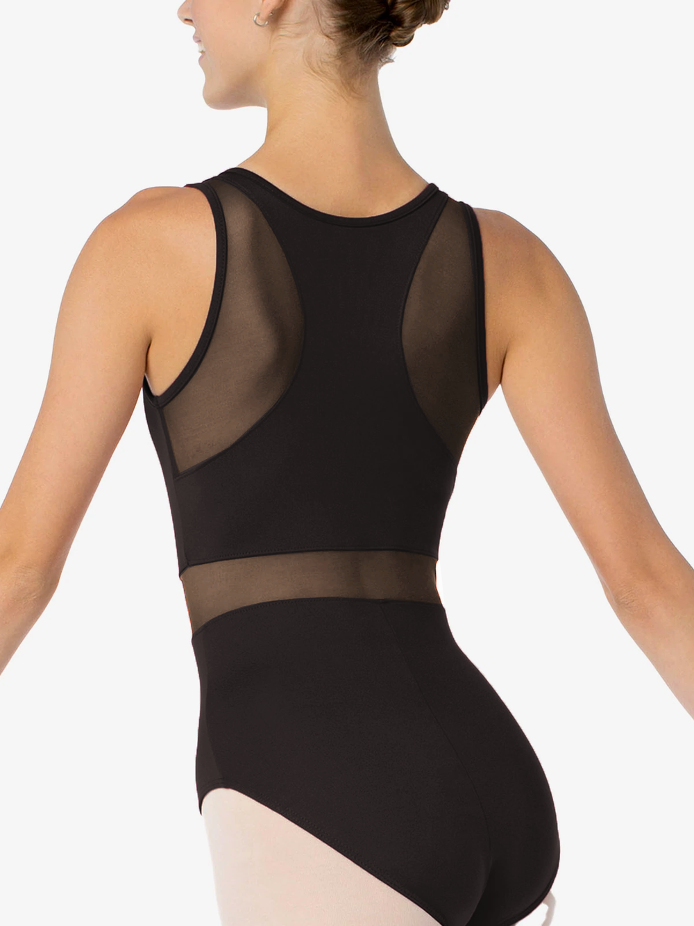 A woman wearing a black tank leotard with mesh detailing on the back. She is facing away from the camera, showing her back and part of her arms. The background is plain white.