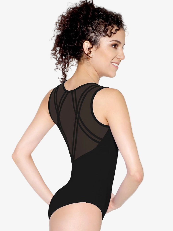 Woman wearing a black leotard with sheer panels on a white background