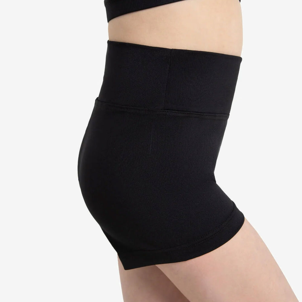 
                      
                        The side profile of a child wearing black, high waisted shorts
                      
                    